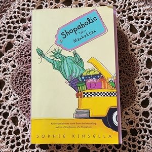 Shopaholic Takes Manhattan. A hardcover novel by Sophie Kinsella
